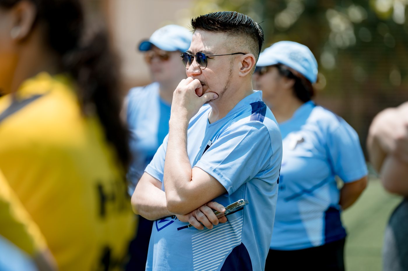 Leader deep in thought watching the match